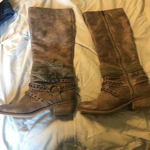 Buckle brand knee high boots.